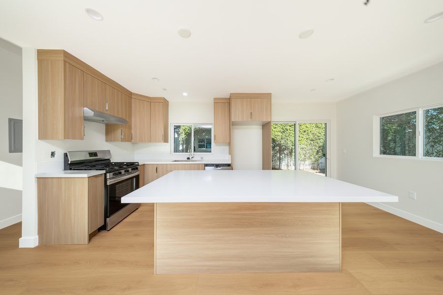 Contemporary kitchen with wood cabinets and modern appliances - new construction Los Angeles